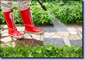 Pressure washing a sidewalk